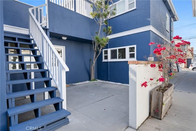 502 36th St, Newport Beach, CA 92663 - view of side of property with stairs, stucco siding, and a patio area