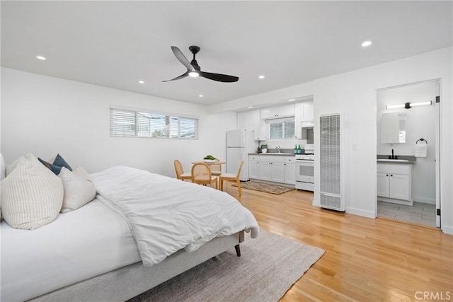 502 36th St, Newport Beach, CA 92663 - bedroom with freestanding refrigerator, light wood-type flooring, a sink, recessed lighting, and a heating unit