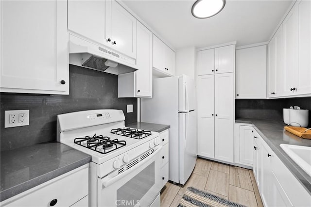 502 36th St, Newport Beach, CA 92663 - kitchen featuring white appliances, under cabinet range hood, and white cabinetry