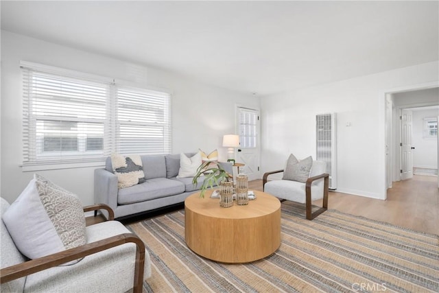 502 36th St, Newport Beach, CA 92663 - living room with a heating unit, healthy amount of natural light, light wood-type flooring, and baseboards