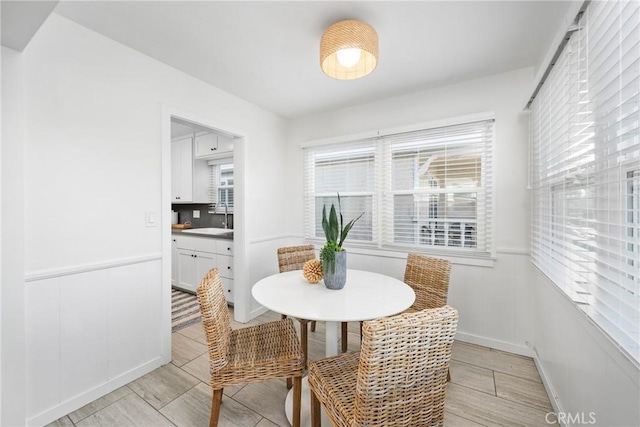 502 36th St, Newport Beach, CA 92663 - dining area featuring plenty of natural light, light wood finished floors, and wainscoting