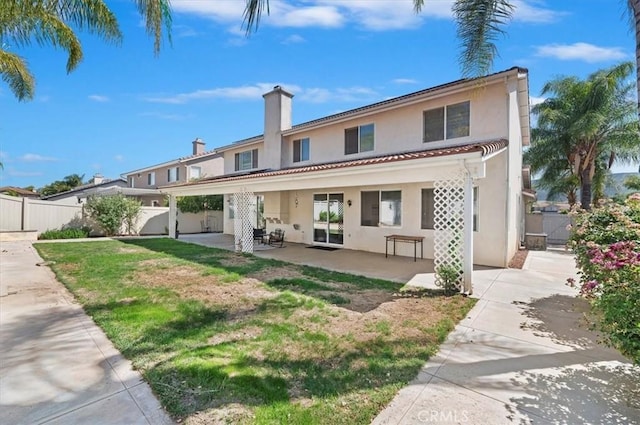 24320 Calle Estancia, Murrieta, CA 92562 - back of house with stucco siding, a patio area, and a tiled roof