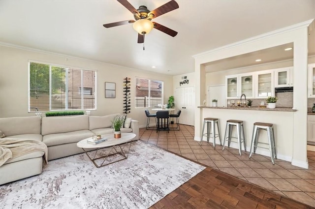 24320 Calle Estancia, Murrieta, CA 92562 - tiled living room featuring plenty of natural light, ornamental molding, a ceiling fan, and recessed lighting