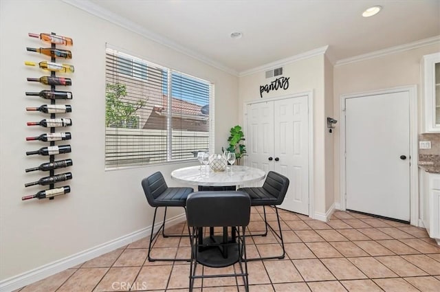 24320 Calle Estancia, Murrieta, CA 92562 - dining area with ornamental molding, light tile patterned floors, and recessed lighting