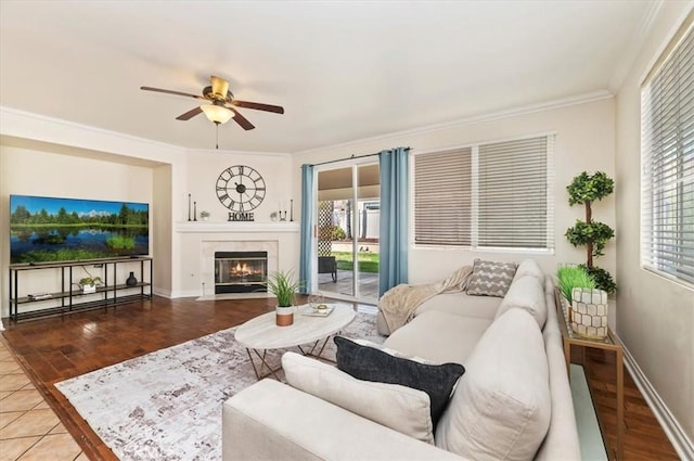24320 Calle Estancia, Murrieta, CA 92562 - living room featuring a ceiling fan, crown molding, wood finished floors, and a tile fireplace
