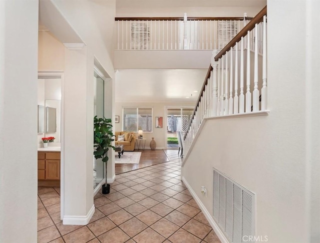 24320 Calle Estancia, Murrieta, CA 92562 - foyer entrance featuring stairs, light tile patterned floors, and a towering ceiling