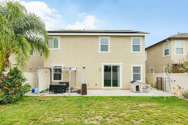 706 Leather Oak Ln, Pomona, CA 91766 - rear view of house featuring a patio area, a pergola, stucco siding, and solar panels