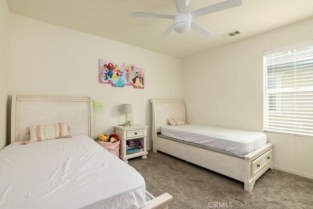 706 Leather Oak Ln, Pomona, CA 91766 - carpeted bedroom featuring multiple windows, baseboards, and a ceiling fan