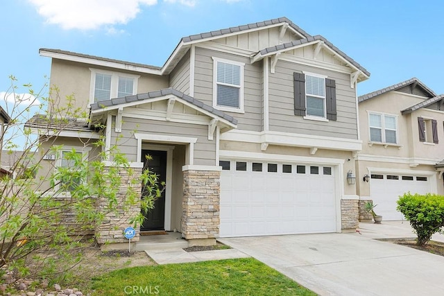 706 Leather Oak Ln, Pomona, CA 91766 - craftsman inspired home with stone siding, a garage, concrete driveway, and board and batten siding