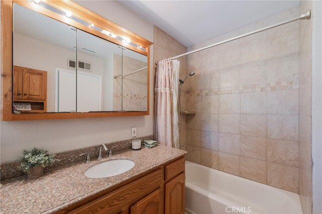 404 N Pear Knl, Anaheim, CA 92805 - bathroom featuring shower / bath combination with curtain and vanity