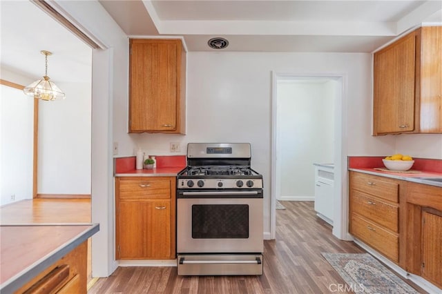 404 N Pear Knl, Anaheim, CA 92805 - kitchen featuring gas stove, wood finished floors, brown cabinets, and light countertops