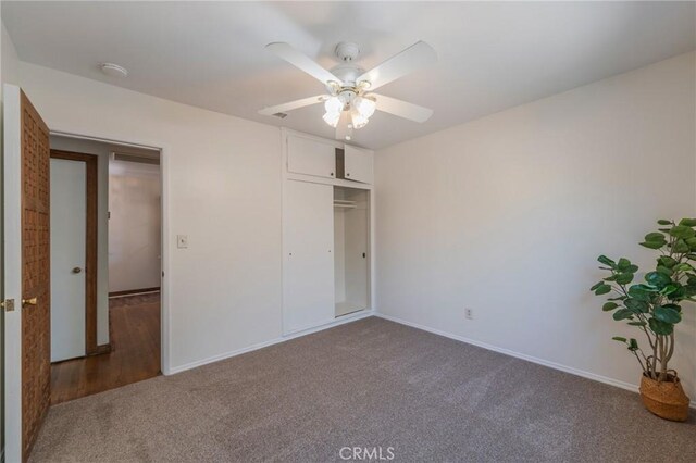 404 N Pear Knl, Anaheim, CA 92805 - unfurnished bedroom featuring carpet flooring, baseboards, a closet, and a ceiling fan