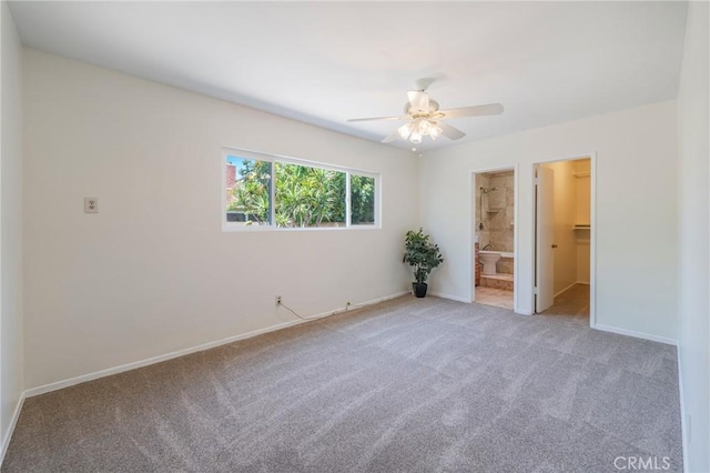 404 N Pear Knl, Anaheim, CA 92805 - unfurnished bedroom with carpet flooring, a spacious closet, baseboards, a ceiling fan, and ensuite bathroom