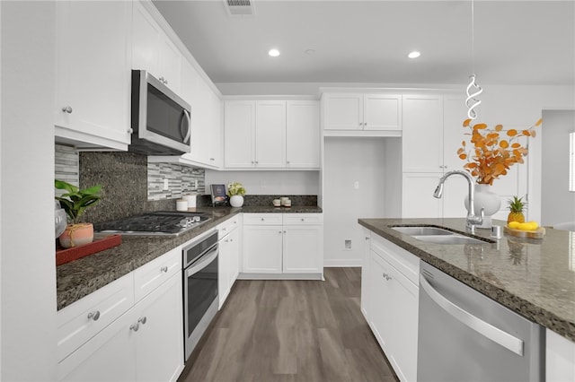 15814 Moonflower Ave, Chino, CA 91708 - kitchen with stainless steel appliances, a sink, white cabinetry, and recessed lighting