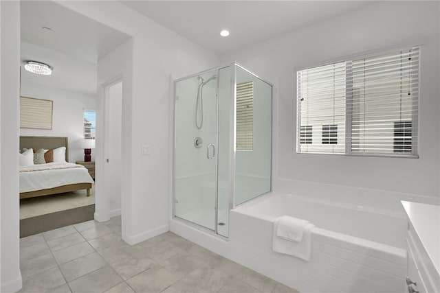 15814 Moonflower Ave, Chino, CA 91708 - ensuite bathroom with a stall shower, a garden tub, tile patterned flooring, and baseboards