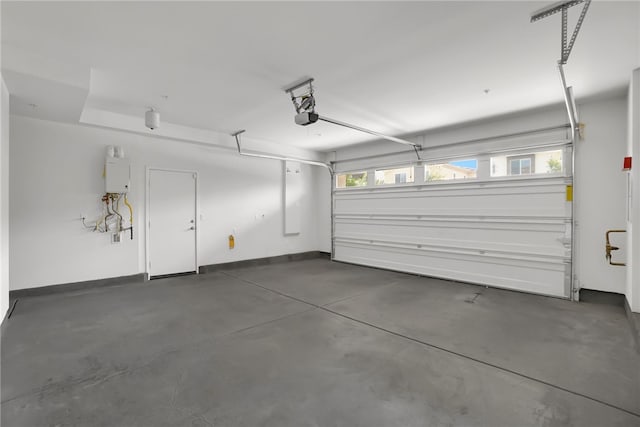 15814 Moonflower Ave, Chino, CA 91708 - garage featuring a garage door opener and baseboards