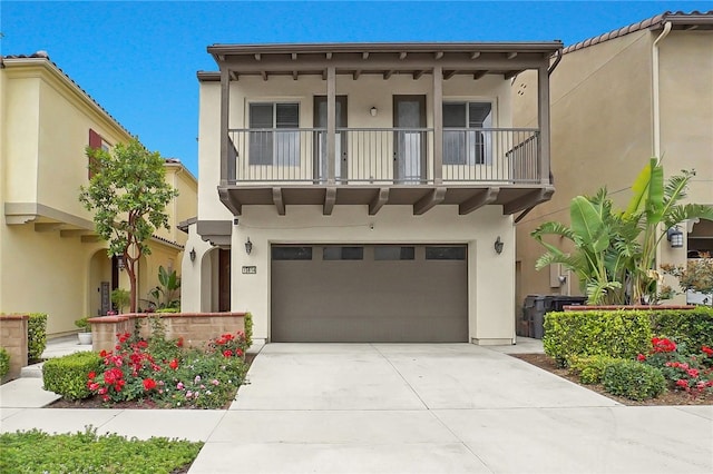 15814 Moonflower Ave, Chino, CA 91708 - view of front of house with a balcony, stucco siding, an attached garage, and driveway