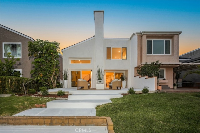 22526 Lake Forest Ln, Lake Forest, CA 92630 - back of property with stucco siding and a lawn