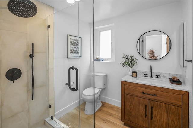 22526 Lake Forest Ln, Lake Forest, CA 92630 - bathroom with a stall shower, vanity, and wood finished floors