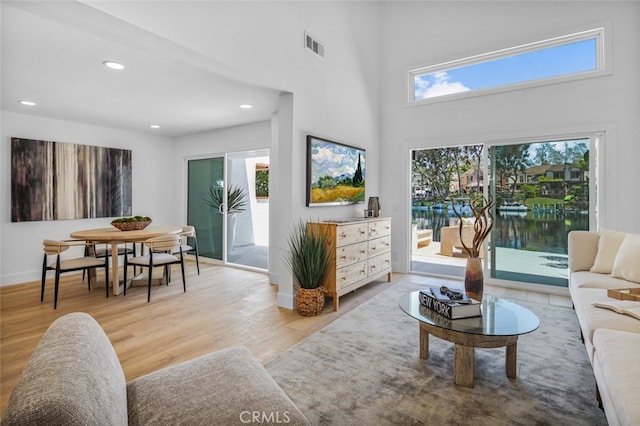 22526 Lake Forest Ln, Lake Forest, CA 92630 - living area featuring wood finished floors, recessed lighting, and a towering ceiling
