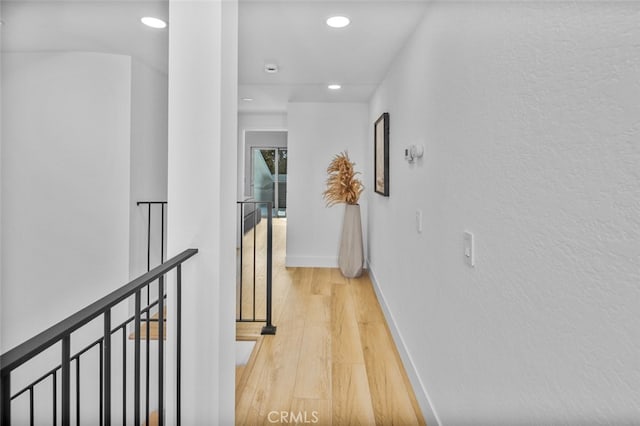 22526 Lake Forest Ln, Lake Forest, CA 92630 - corridor with recessed lighting, wood finished floors, and an upstairs landing