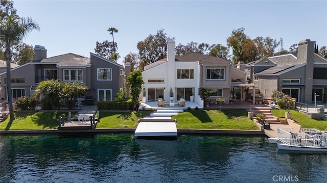 22526 Lake Forest Ln, Lake Forest, CA 92630 - back of house featuring a water view, a patio, a residential view, and stucco siding