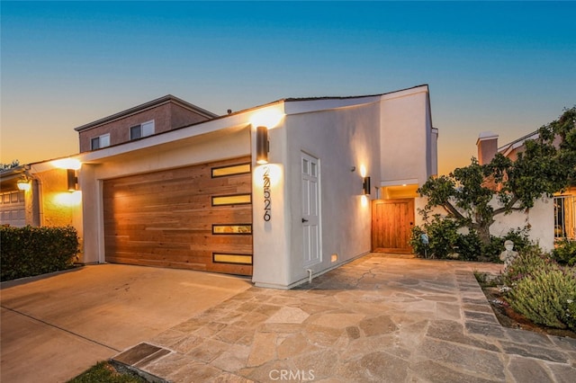 22526 Lake Forest Ln, Lake Forest, CA 92630 - view of front of property with driveway, stucco siding, and a garage