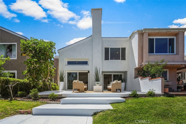 22526 Lake Forest Ln, Lake Forest, CA 92630 - rear view of property with stucco siding, a patio area, and an outdoor hangout area