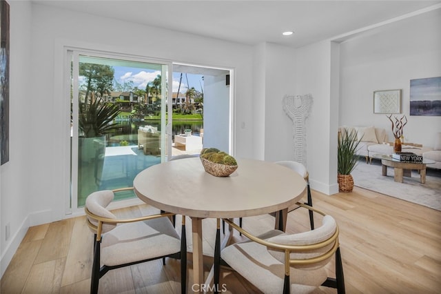22526 Lake Forest Ln, Lake Forest, CA 92630 - dining space with light wood-style flooring, recessed lighting, and a water view