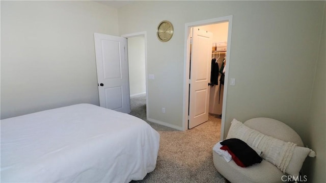 27506 Aster Way, Saugus, CA 91350 - bedroom featuring light carpet, a walk in closet, and baseboards