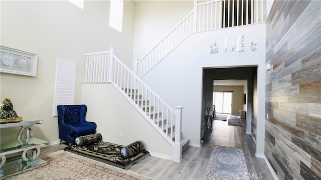 27506 Aster Way, Saugus, CA 91350 - entrance foyer with stairs, wood finished floors, a towering ceiling, and baseboards