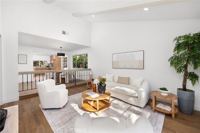 10012 Glade Ave, Chatsworth, CA 91311 - living area with wood finished floors, baseboards, beam ceiling, high vaulted ceiling, and recessed lighting
