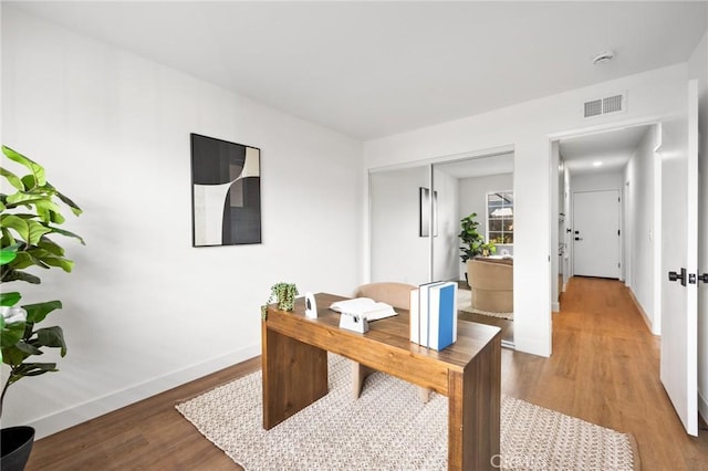 10012 Glade Ave, Chatsworth, CA 91311 - home office with light wood-style flooring and baseboards