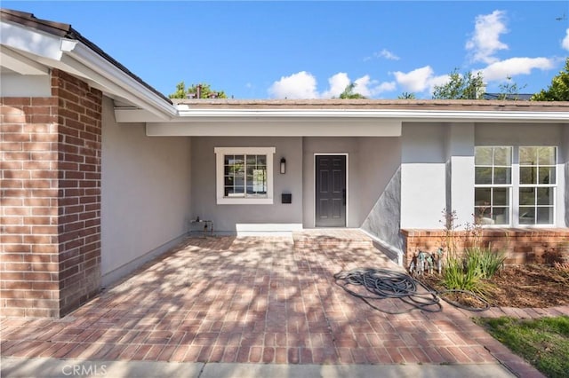 10012 Glade Ave, Chatsworth, CA 91311 - property entrance featuring stucco siding, brick siding, and a patio area