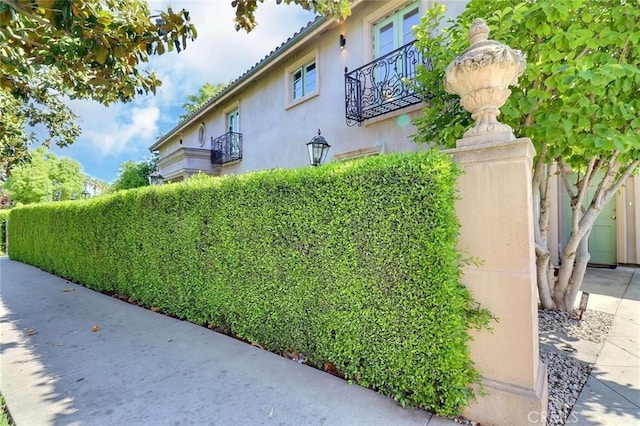 8424 Sunnyslope Dr, San Gabriel, CA 91775 - view of side of home featuring a balcony and stucco siding