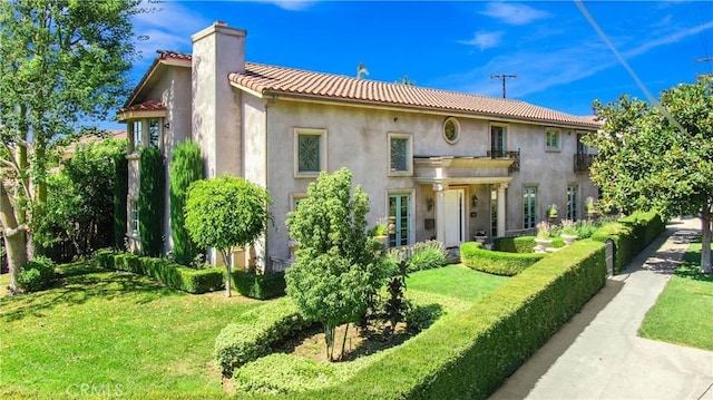 8424 Sunnyslope Dr, San Gabriel, CA 91775 - rear view of house with stucco siding, a chimney, a tile roof, and a yard