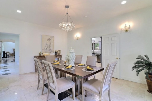 8424 Sunnyslope Dr, San Gabriel, CA 91775 - dining space featuring arched walkways, a chandelier, baseboards, and recessed lighting