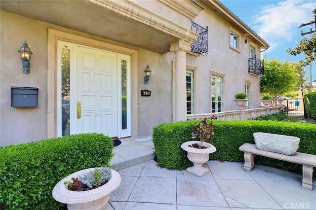 8424 Sunnyslope Dr, San Gabriel, CA 91775 - doorway to property with stucco siding and a balcony