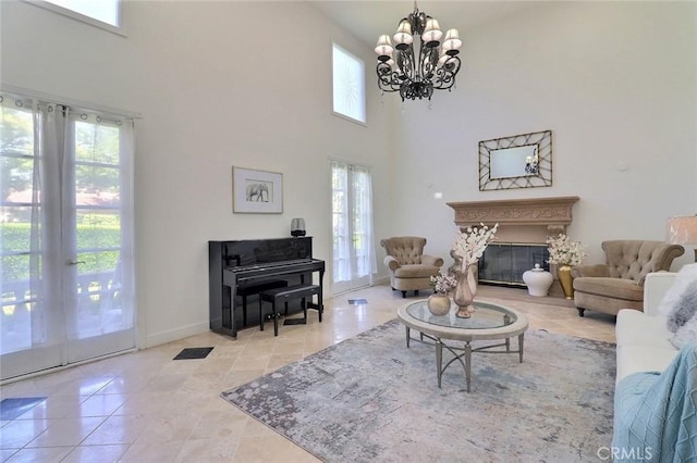 8424 Sunnyslope Dr, San Gabriel, CA 91775 - living area with plenty of natural light, a glass covered fireplace, a high ceiling, a chandelier, and baseboards