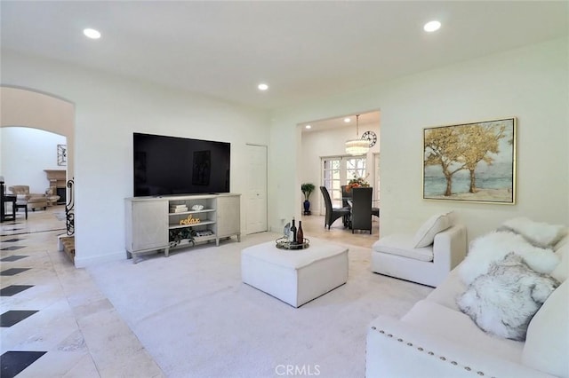8424 Sunnyslope Dr, San Gabriel, CA 91775 - living room with arched walkways, recessed lighting, light tile patterned flooring, and a chandelier