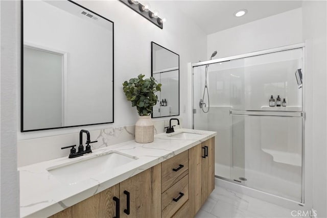 1733 San Eugenio, San Diego, CA 92154 - bathroom featuring a stall shower, marble look tiles, double vanity, and recessed lighting