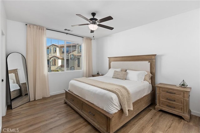 1733 San Eugenio, San Diego, CA 92154 - bedroom with light wood-style flooring, a ceiling fan, and baseboards