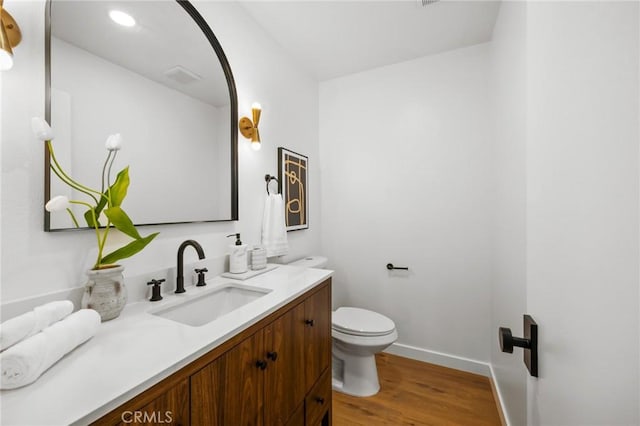 230 Gila Way, Placentia, CA 92870 - bathroom with toilet, wood finished floors, vanity, and baseboards