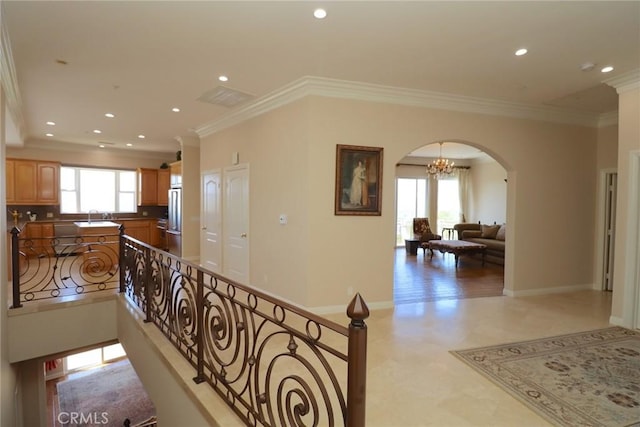 485 Kathleen Dr, Newbury Park, CA 91320 - corridor featuring arched walkways, a sink, recessed lighting, crown molding, and baseboards
