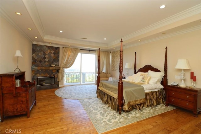 485 Kathleen Dr, Newbury Park, CA 91320 - bedroom featuring access to outside, wood finished floors, a tray ceiling, a fireplace, and ornamental molding