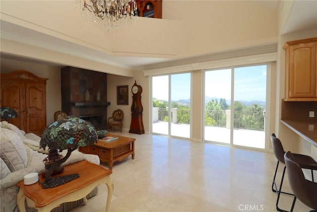 485 Kathleen Dr, Newbury Park, CA 91320 - living area featuring a chandelier, a fireplace, and crown molding