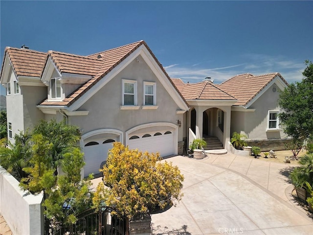 485 Kathleen Dr, Newbury Park, CA 91320 - view of front facade featuring stucco siding, a garage, driveway, and a tile roof