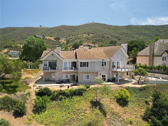 485 Kathleen Dr, Newbury Park, CA 91320 - rear view of house with a chimney, a balcony, and a patio