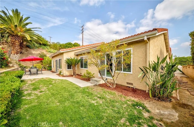 2501 Tiffany Pl, Fullerton, CA 92833 - back of property featuring stucco siding, a yard, and a patio area