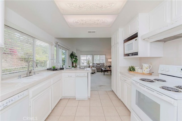 2501 Tiffany Pl, Fullerton, CA 92833 - kitchen with white appliances, a sink, white cabinetry, light tile patterned floors, and open floor plan